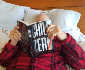 Gayle’s husband, John Sheldon, kept disappearing to nap, but she caught him doing what he really wanted to do — read Chris Holm's Child Zero.