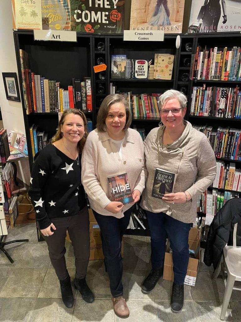 Tracy Clark, Loris Rader-Day, and guests at a book launch